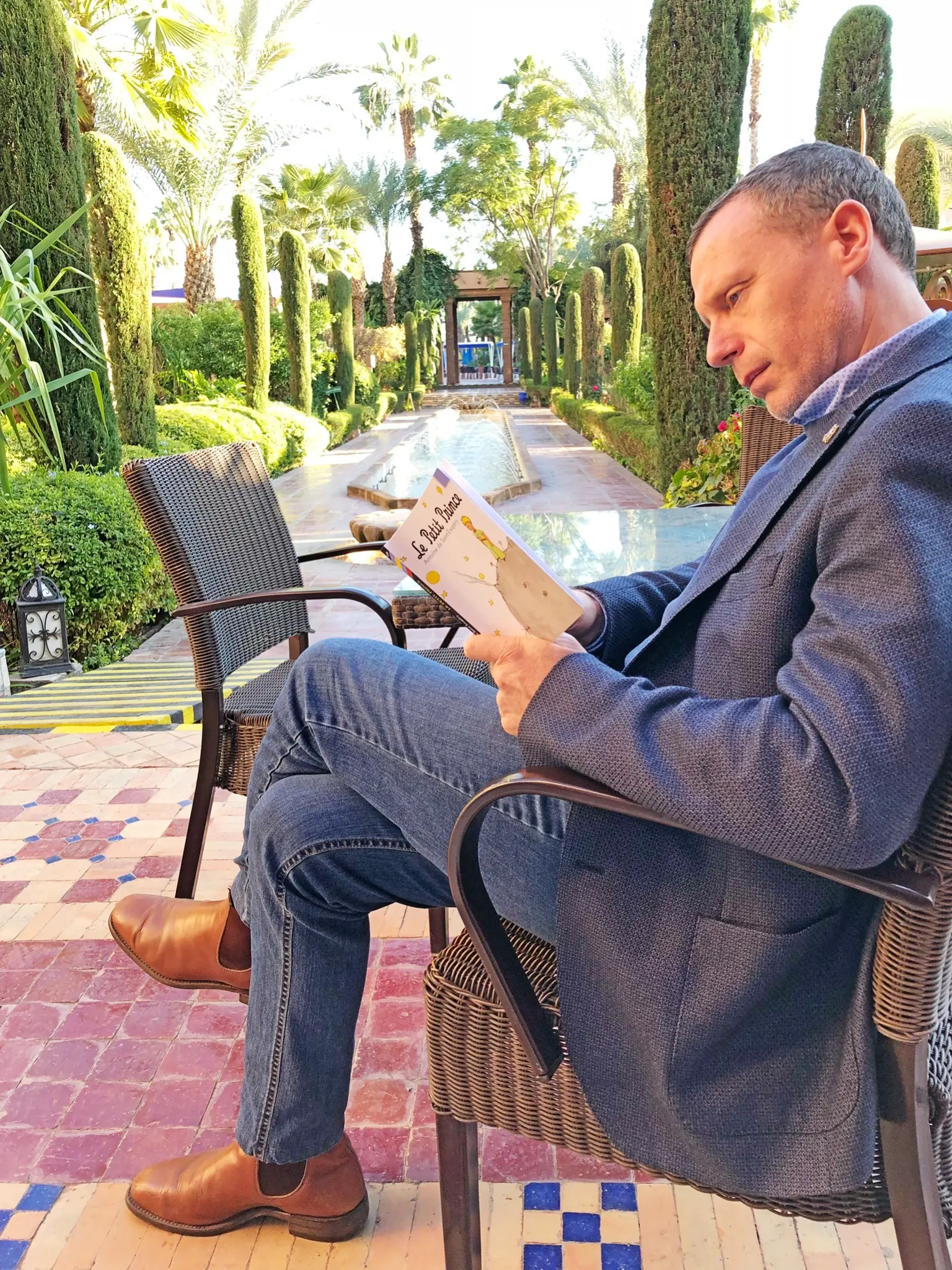 Earle G. Hall reading Le Petit Prince in Marrakech, Morocco