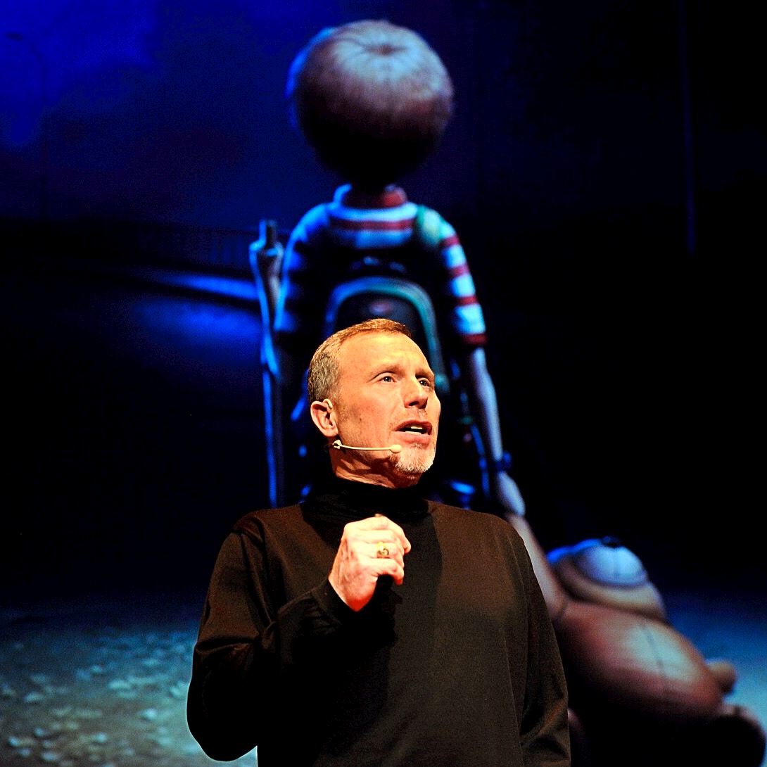 Earle G. Hall speaking on stage